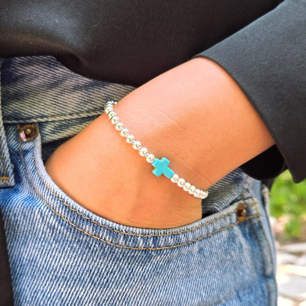 Sterling silver bracelet with turquoise cross charm