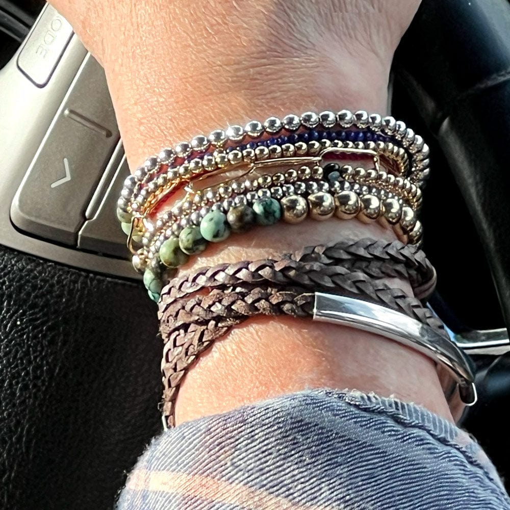 sterling silver beaded 4mm bracelet stacked w 14k gold filled bracelets and a braided leather wrap bracelet