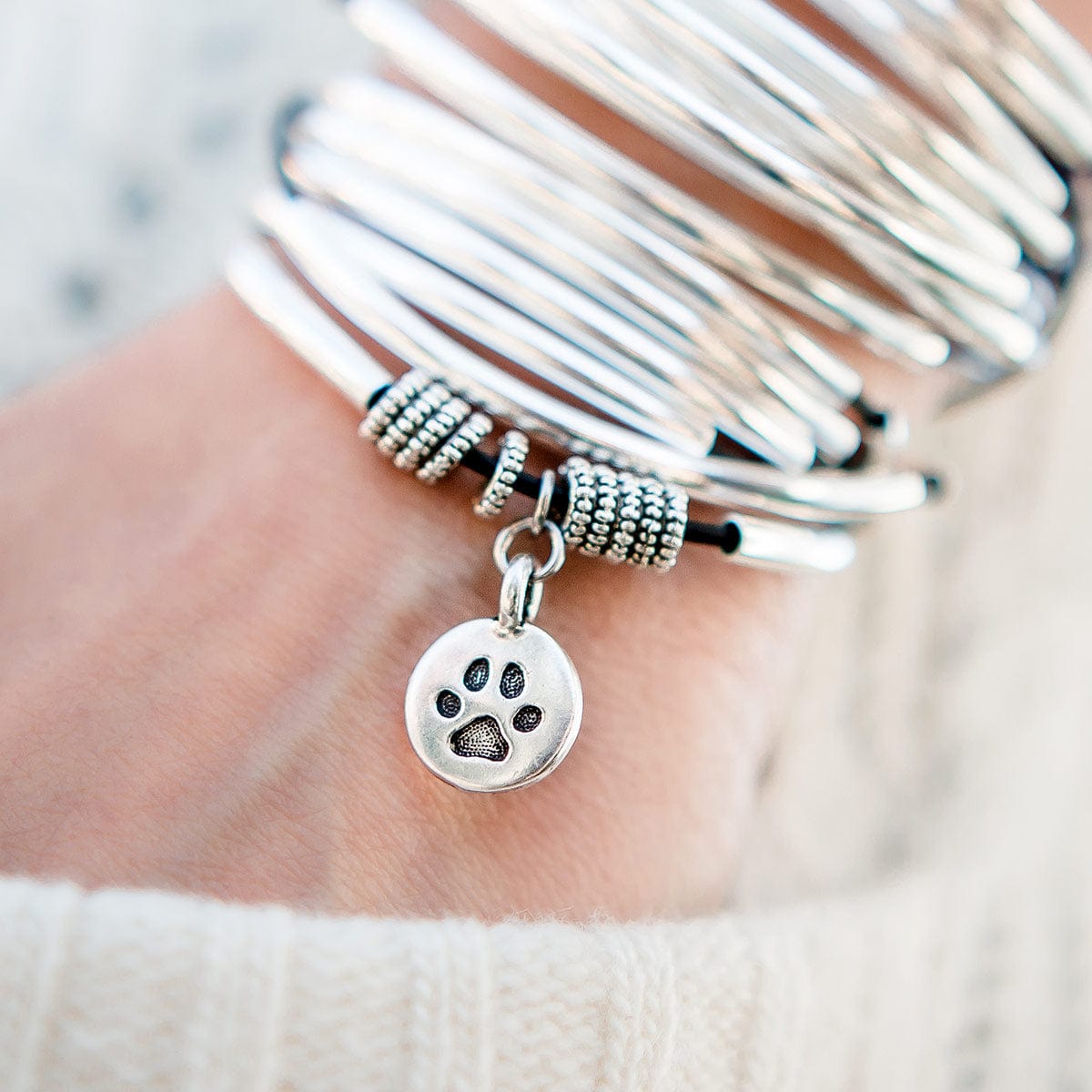 Stevie bracelet with round paw charm, paired with Lizzy Classic bracelet